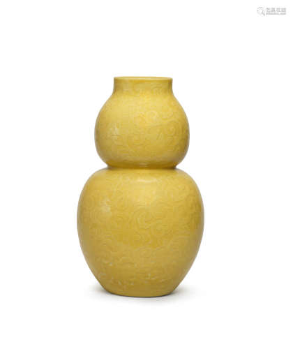 By Seifu Yohei III (1851-1914), Meiji (1868-1912) or Taisho (1912-1926) era, early 20th century A mustard-yellow-glazed double-gourd bottle vase