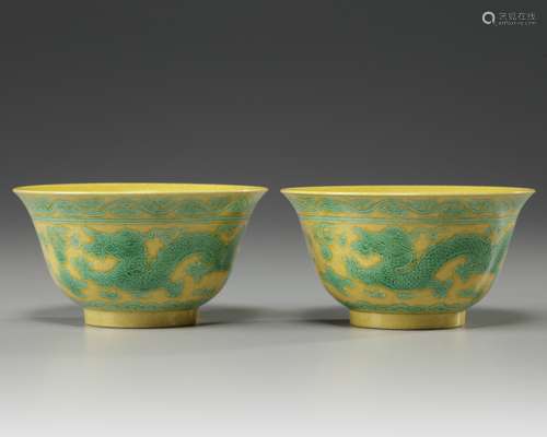 A pair of Chinese yellow-ground green-enamelled 'dragon' bowls