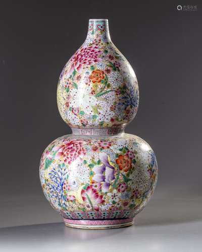 A Chinese famille rose 'millefleurs' double gourd vase