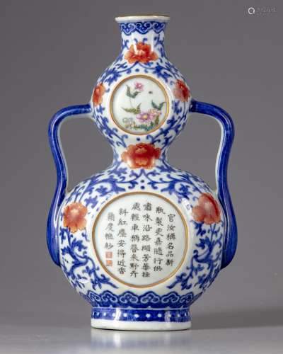 A Chinese blue and white double gourd wall vase