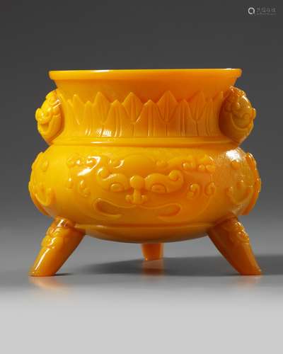 A Chinese opaque yellow glass tripod censer