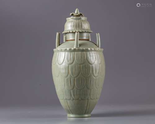 A celadon glazed vase and cover