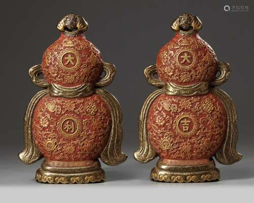 A pair of Chinese imitation lacquer double gourd wall vases