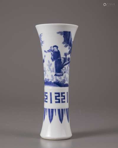 A blue and white beaker vase