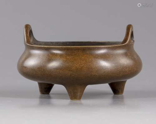 A Chinese bronze tripod censer