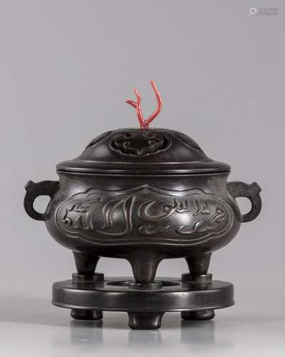 A bronze censer with wooden stand and cover