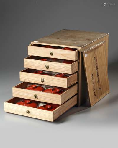 A thirty-piece red lacquered sake set