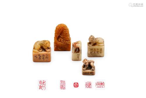 A group of five carved soapstone seals