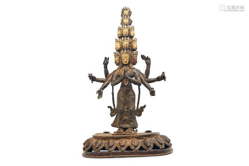 A parcel gilt bronze figure of an eleven-headed Avalokiteshvara