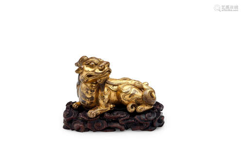 A gilt bronze paperweight of a mythical beast