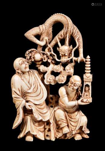 ϒ A carved ivory group of Luohan and dragon