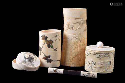 ϒ A Japanese Ivory Box and Cover of natural oval section decorated in high relief with a farmer