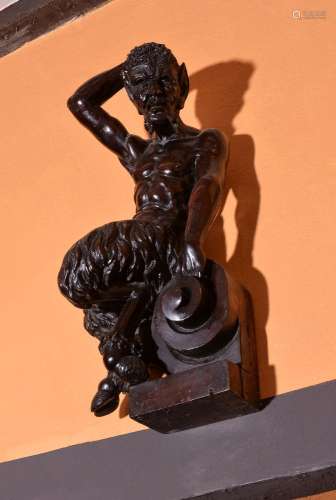 A Continental, possibly Netherlandish, carved and stained oak model of a satyr