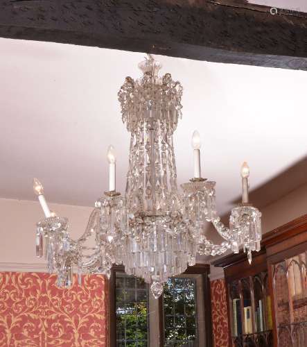 A cut glass eight light chandelier in late George III style