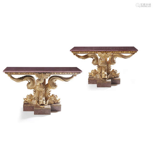 PAIR OF 'BRIDGWATER HOUSE' STYLE GILTWOOD, SCAGLIOLA PORPHYRY, AND PAINTED DOLPHIN CONSOLE TABLES