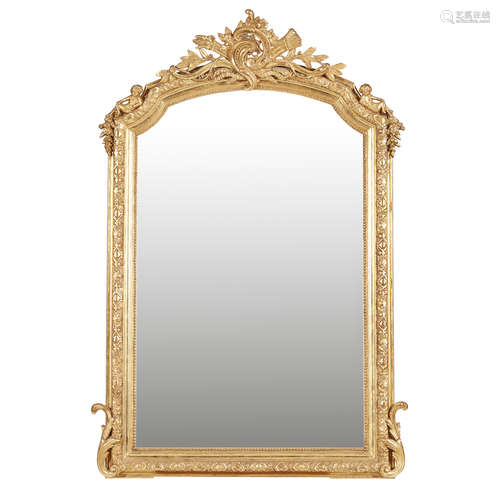 FRENCH GILT OVERMANTEL MIRROR 19TH CENTURY in the Louis XIV style, the arched mirror plate in a