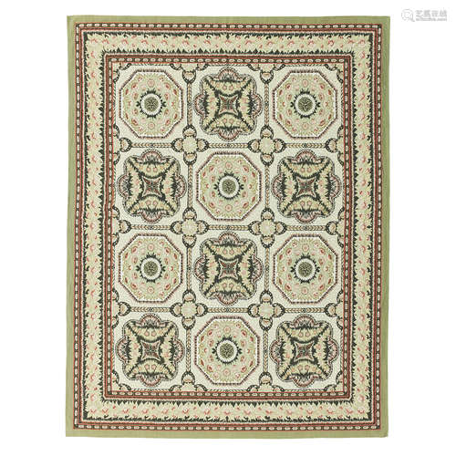 AUBUSSON STYLE CARPET LATE 20TH CENTURY the patterned olive field with three columns of four