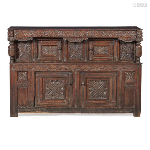 CHARLES I OAK CUPBOARD MID 17TH CENTURY WITH ALTERATIONS the flower head and lozenge carved