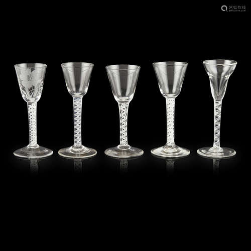 FIVE GEORGIAN OPAQUE TWIST STEM WINE GLASSES 18TH CENTURY comprising four examples with round funnel