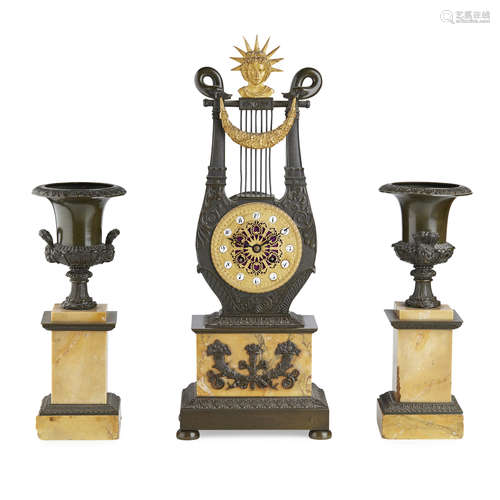 FRENCH EMPIRE STYLE THREE PIECE CLOCK GARNITURE 19TH CENTURY in gilt and patinated bronze, the lyre-