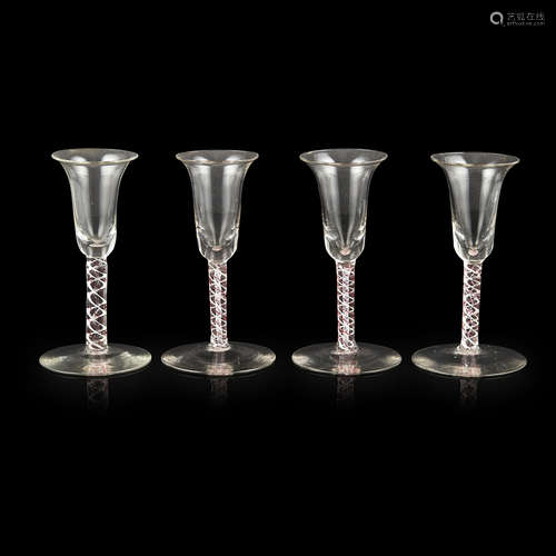 FOUR DUTCH OPAQUE AND RED ENAMEL TWIST STEM WINE GLASSES 18TH CENTURY with bell-shaped bowls