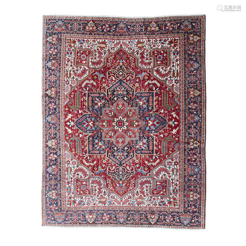 HERIZ CARPET NORTHWEST PERSIA, EARLY 20TH CENTURY the red field with indigo and salmon pink