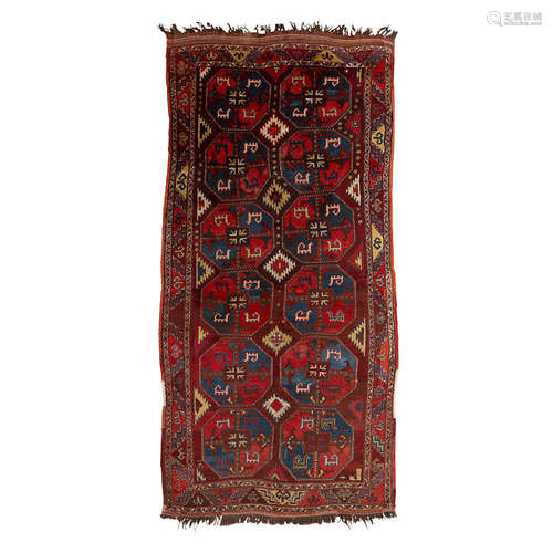 KARAKALPAK LONG CARPET UZBEKISTAN, LATE 19TH CENTURY the brownish red field with two columns of