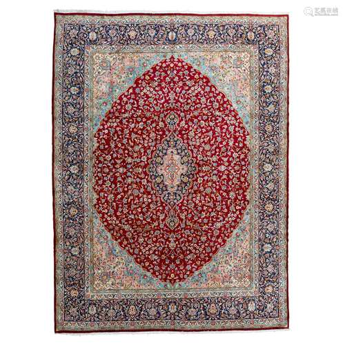 KIRMAN CARPET CENTRAL PERSIA, MID 20TH CENTURY the raspberry field with indigo and pink medallion,