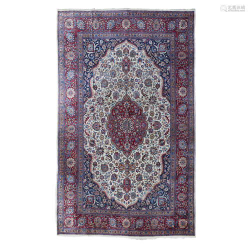 KHORASSAN CARPET NORTHEAST PERSIA, EARLY 20TH CENTURY the cream field with raspberry medallion,