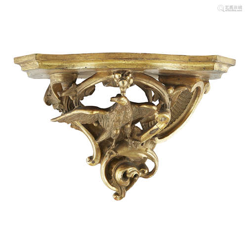 LARGE CONTINENTAL GILTWOOD WALL BRACKET 19TH CENTURY the serpentine platform over a carved eagle and