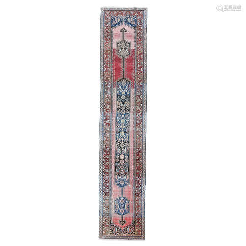 MALAYER RUNNER WEST PERSIA, LATE 19TH/EARLY 20TH CENTURY the abrash red field with elongated