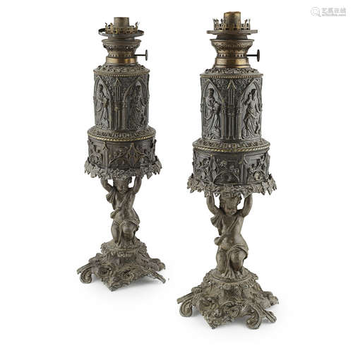 PAIR OF CONTINENTAL BRASS OIL LAMP BASES 19TH CENTURY embossed with religious figures within pointed