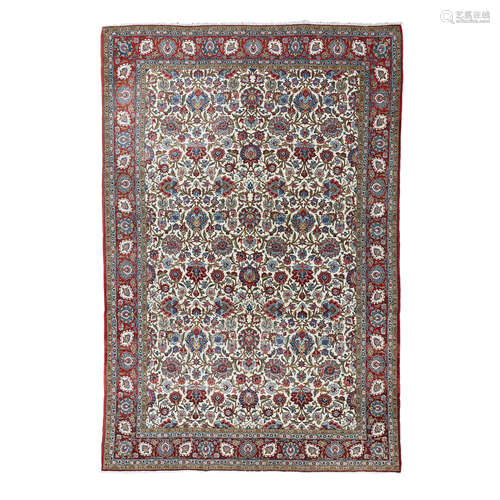 QUM CARPET CENTRAL PERSIA, EARLY 20TH CENTURY the cream field with allover palmette and vine