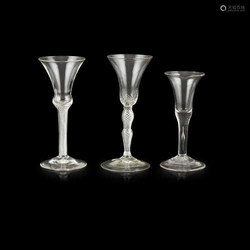 THREE GEORGIAN WINE GLASSES 18TH CENTURY all with trumpet bowls, comprising a large example with a