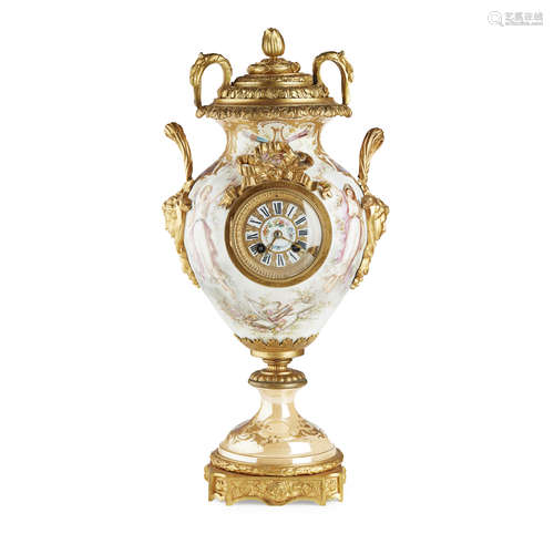 FRENCH PORCELAIN AND GILT BRONZE MANTEL CLOCK 19TH CENTURY of urn form with gilt bronze mask handles