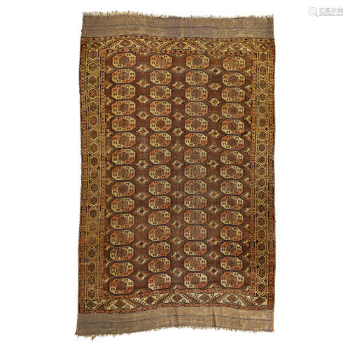 CHODOR CARPET TURKMENISTAN, EARLY 19TH CENTURY the brown field with four columns of fifteen guls,