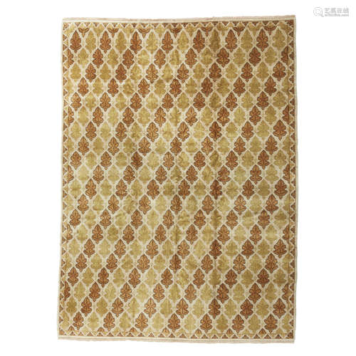 ARTS AND CRAFTS STYLE CARPET EUROPE, 20TH CENTURY the cream field with allover brown and green