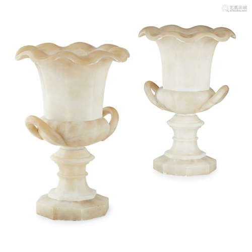 PAIR OF ITALIAN ALABASTER URNS LATE 19TH/ EARLY 20TH CENTURY of campana form with wavy rims and