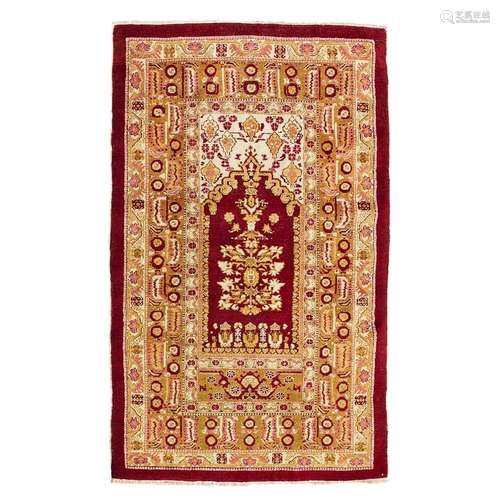 AGRA PRAYER RUG NORTH INDIA, EARLY 20TH CENTURY the red mihrab with cream spandrels, within olive