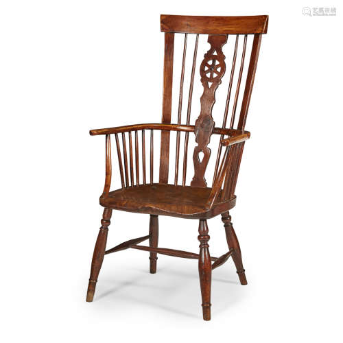 YEW AND ELM WINDSOR ARMCHAIR EARLY 19TH CENTURY the curved top rail above a pierced wheel splat