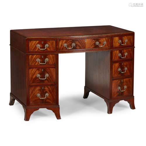 GEORGIAN STYLE MAHOGANY BOWFRONT KNEEHOLE DESK LATE 19TH CENTURY the crossbanded top with a brown