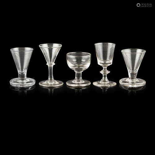 GROUP OF GEORGIAN GLASSES 18TH CENTURY comprising two firing glasses with flared bowls, largest