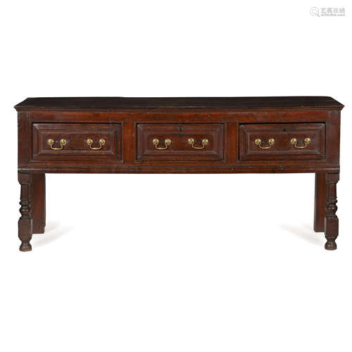 GEORGE II OAK DRESSER BASE 18TH CENTURY with three moulded short drawers, raised on baluster