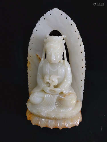 A HETIAN JADE CARVED LUOHAN FIGURE