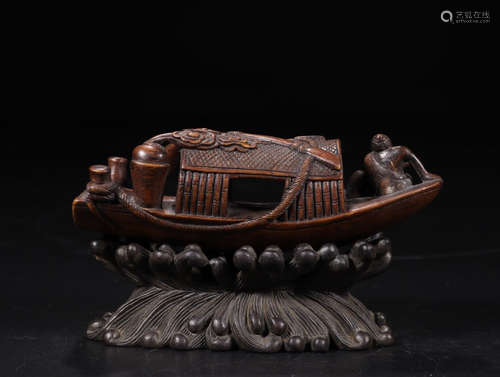 A BAMBAOO ORNAMENT OF FISHING BOAT