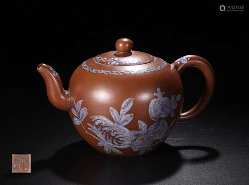 A ZISHA TEAPOT WITH WRITTEN POTTERY AND MARKING