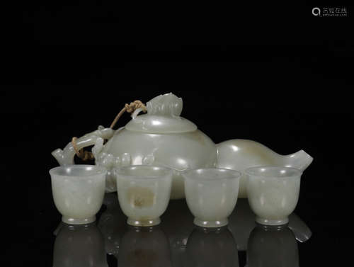 A SET OF FIVE HETIAN JADE TEA WARES, INCLUDING TEAPOT AND FOUR TEA CUPS