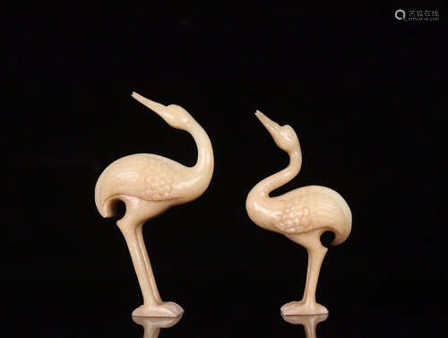 A PAIR OF OLD JADE CRANE ORNAMENTS