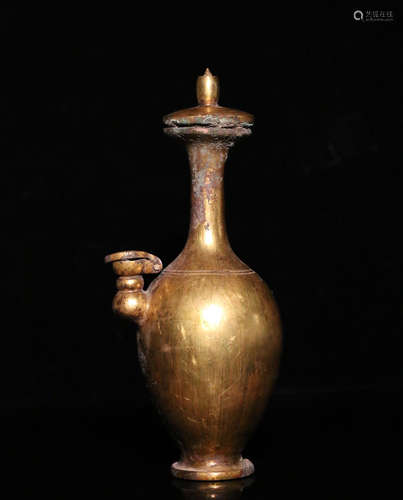 A GILT COPPER VASE