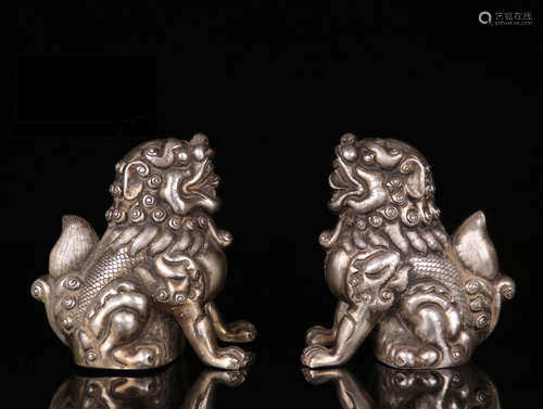 A PAIR OF SILVER ORNMANETS OF MALE LION